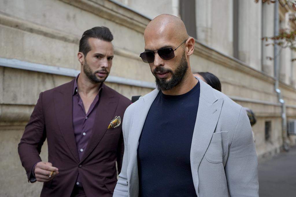Andrew Tate and his brother Tristan, left, walk outside the Court of Appeals building, after a hearing, in Bucharest, Romania, Wednesday, Sept. 4, 2024.