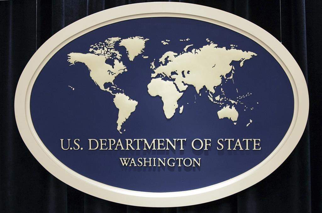 FILE - In this Aug. 10, 2006, file photo, the sign used as the backdrop for press briefings at the U.S. Department of State is seen before a news conference at the State Department in Washington. (AP Photo/Charles Dharapak, File).