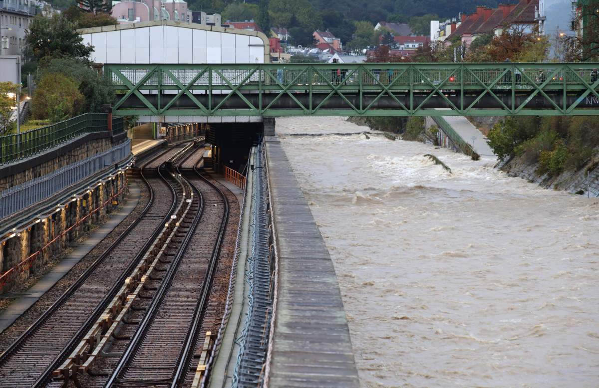 River Wien floods its banks next to tracks and a closed subway station in the west of Vienna, Austria, on Sunday. (AP Photo/Heinz-Peter Bader)