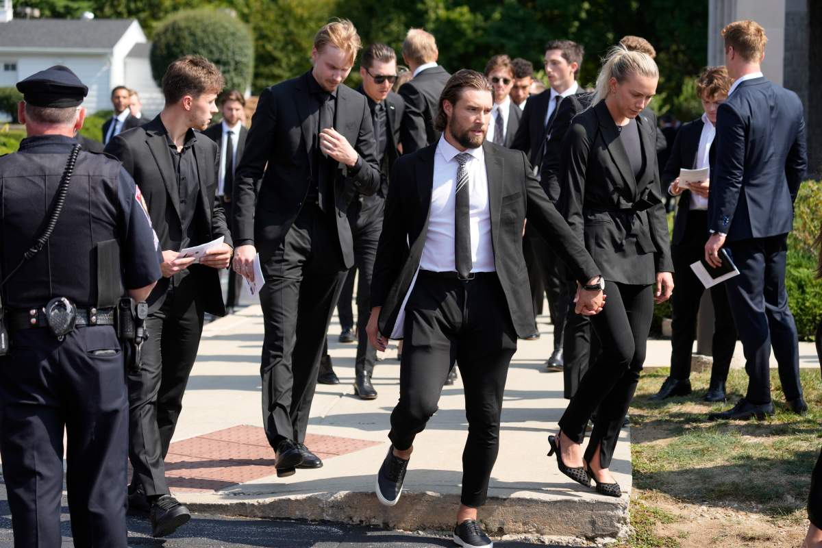 Mourners, including hockey player Sean Monahan, depart following the funeral for Columbus Blue Jackets hockey player John Gaudreau and his brother Matthew Gaudreau at St. Mary Magdalen Catholic Church in Media, Pa., Monday, Sept. 9, 2024.