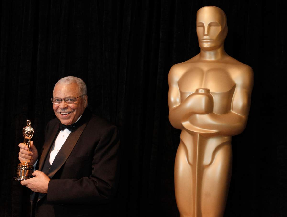 FILE – James Earl Jones poses with his honorary Oscar at the 84th Academy Awards on Sunday, Feb. 26, 2012, in the Hollywood section of Los Angeles. Jones, who overcame racial prejudice and a severe stutter to become a celebrated icon of stage and screen has died at age 93, Monday, Sept. 9, 2024. (AP Photo/Chris Carlson, File)