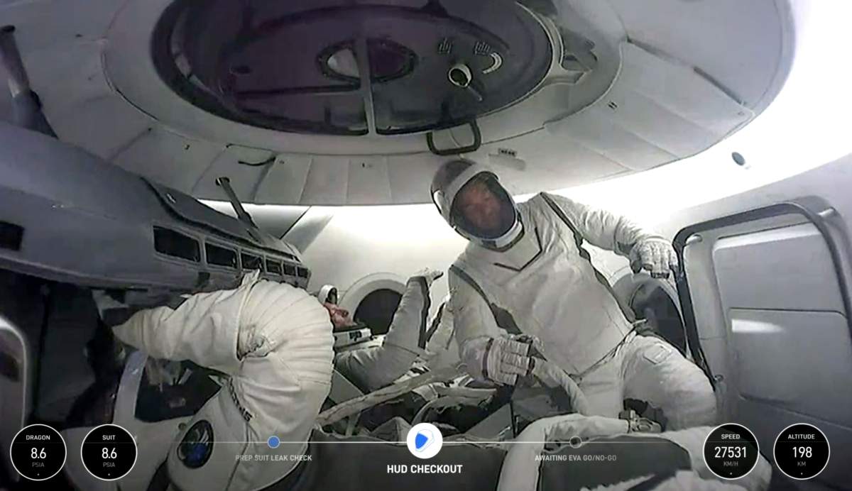 This image made from a The crew of the first private spacewalk floating inside the capsule, Thursday Sept. 12, 2024.