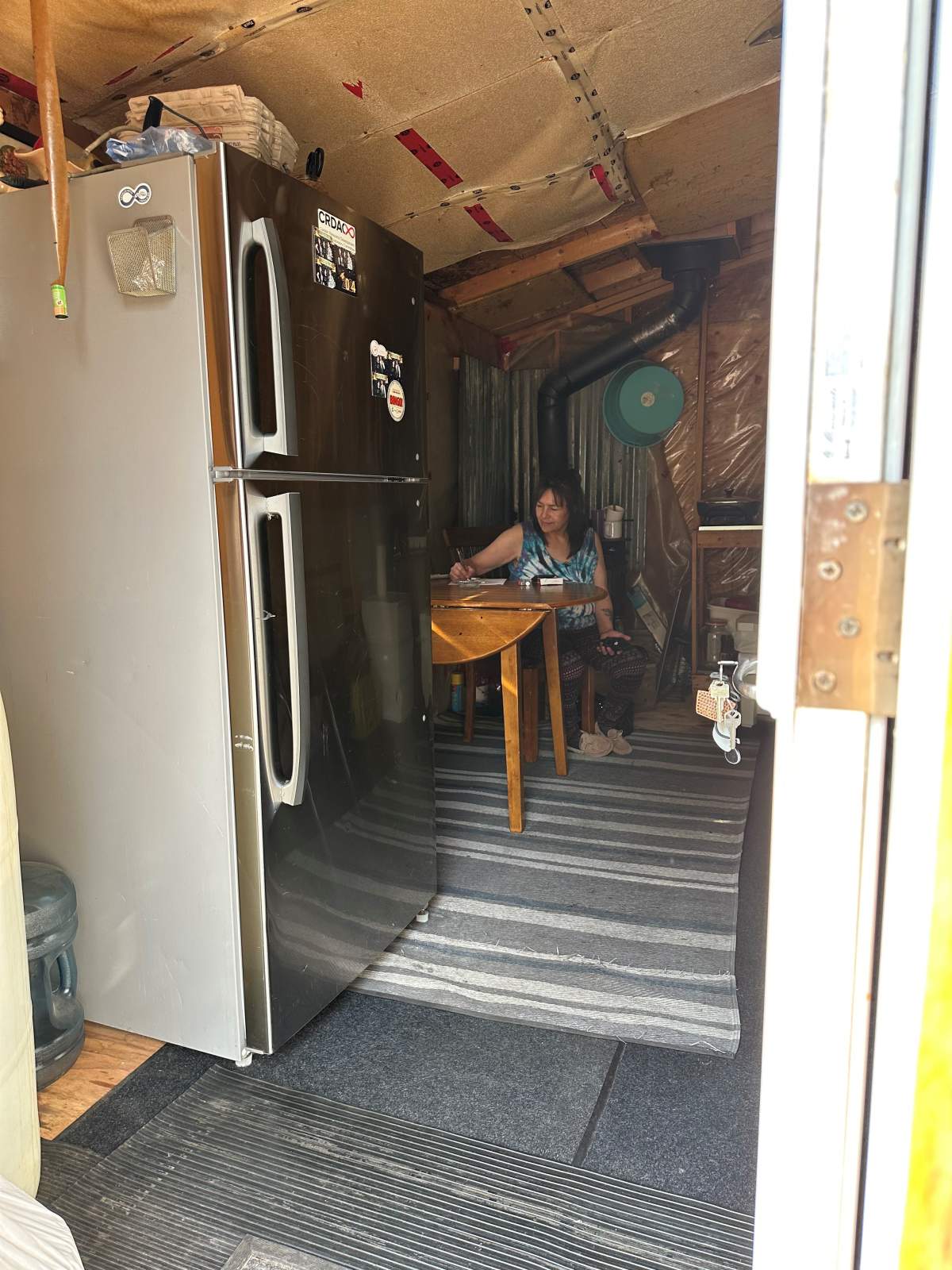Darlene Richards inside her camper trailer in Conklin, Alta. in September 2024.