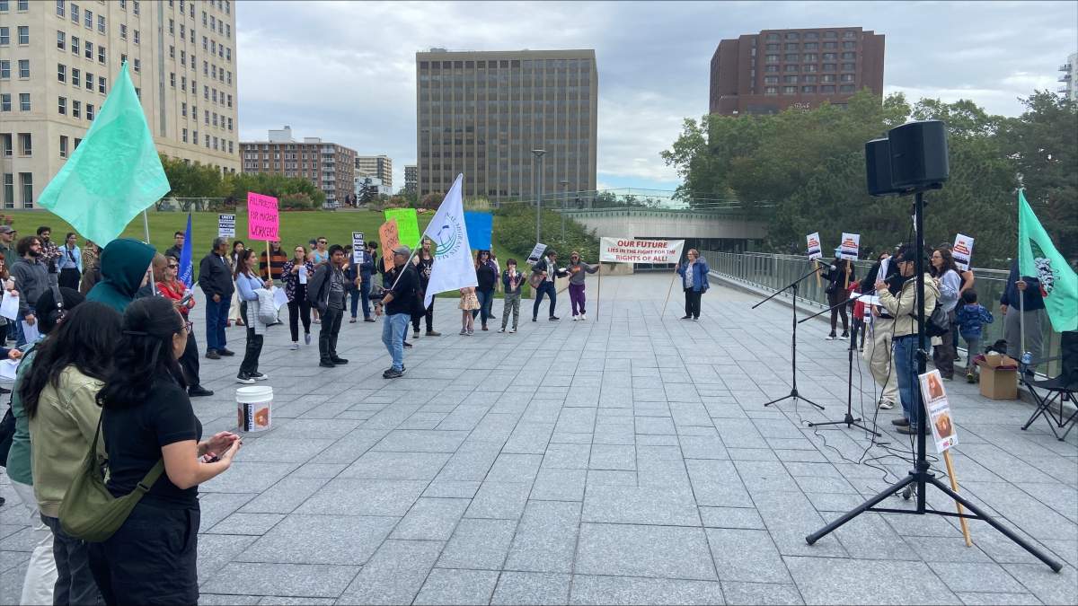 Demonstrators turned up at a rally in downtown Edmonton on Saturday to call on the federal government to take more action to "regularize" undocumented workers in Canada.