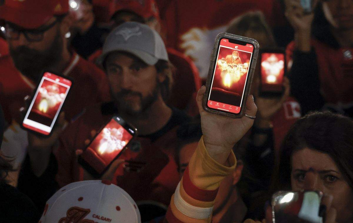 Fans attend a vigil for former Calgary Flames player Johnny Gaudreau and his brother Matthew in Calgary, Alta., Wednesday, Sept. 4, 2024. The brothers were struck and killed by a suspected drunk driver last week while cycling near their childhood home in New Jersey.