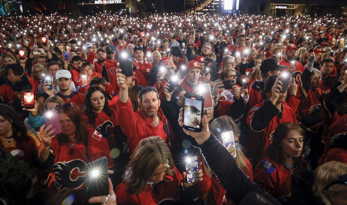 Fans attend a vigil for former Calgary Flames player Johnny Gaudreau and his brother Matthew in Calgary, Alta., Wednesday, Sept. 4, 2024. The brothers were struck and killed by a suspected drunk driver last week while cycling near their childhood home in New Jersey.