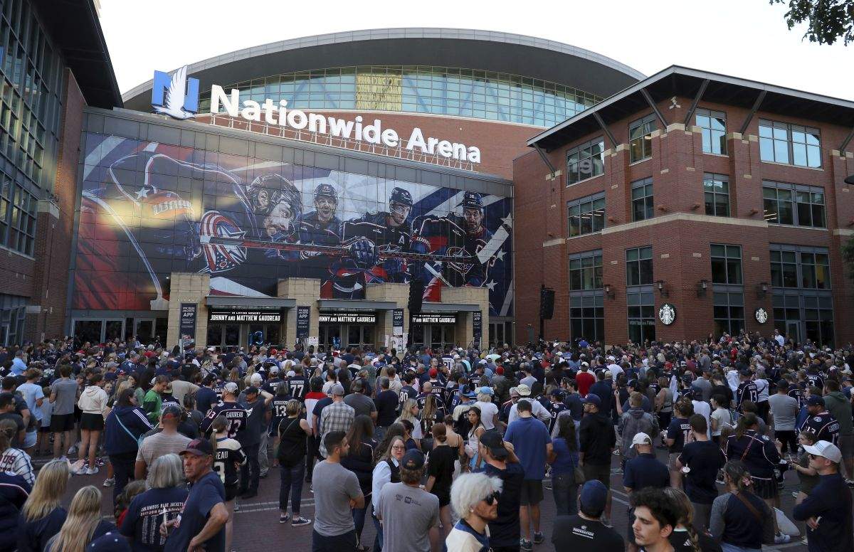 Fans gather for a candlelight vigil to honour Columbus Blue Jackets hockey player Johnny Gaudreau, outside of Nationwide Arena in Columbus, Ohio, Wednesday, Sept. 4, 2024. Gaudreau and his brother Matthew were killed by a motor vehicle last week while riding bicycles.