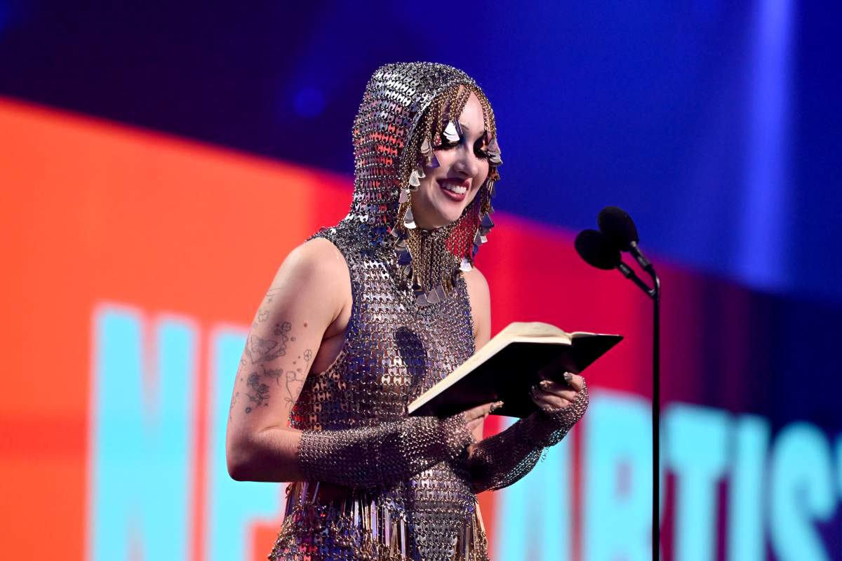 Chappel Roan wearing chain mail on stage.