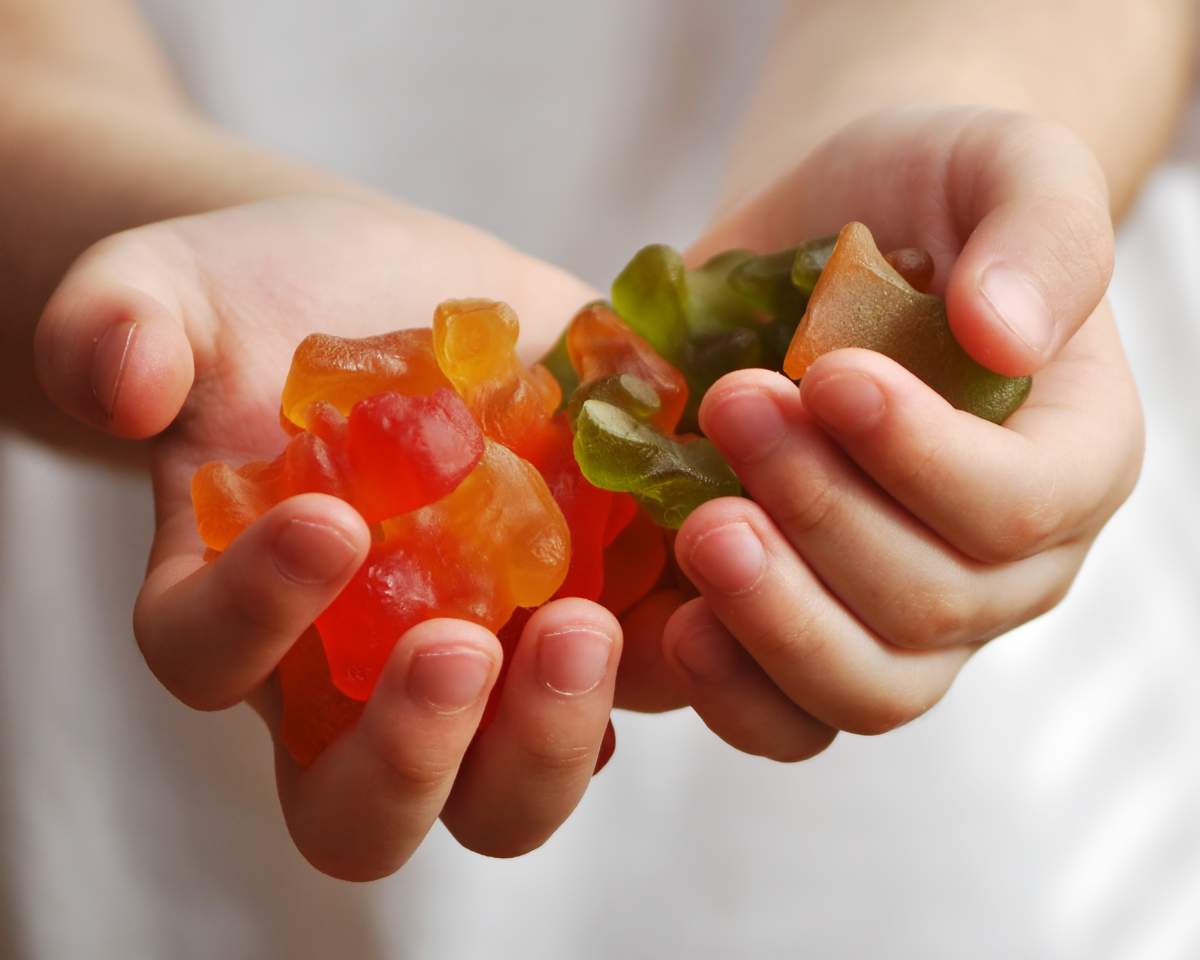 File photo of gummy bears in a child's hands.