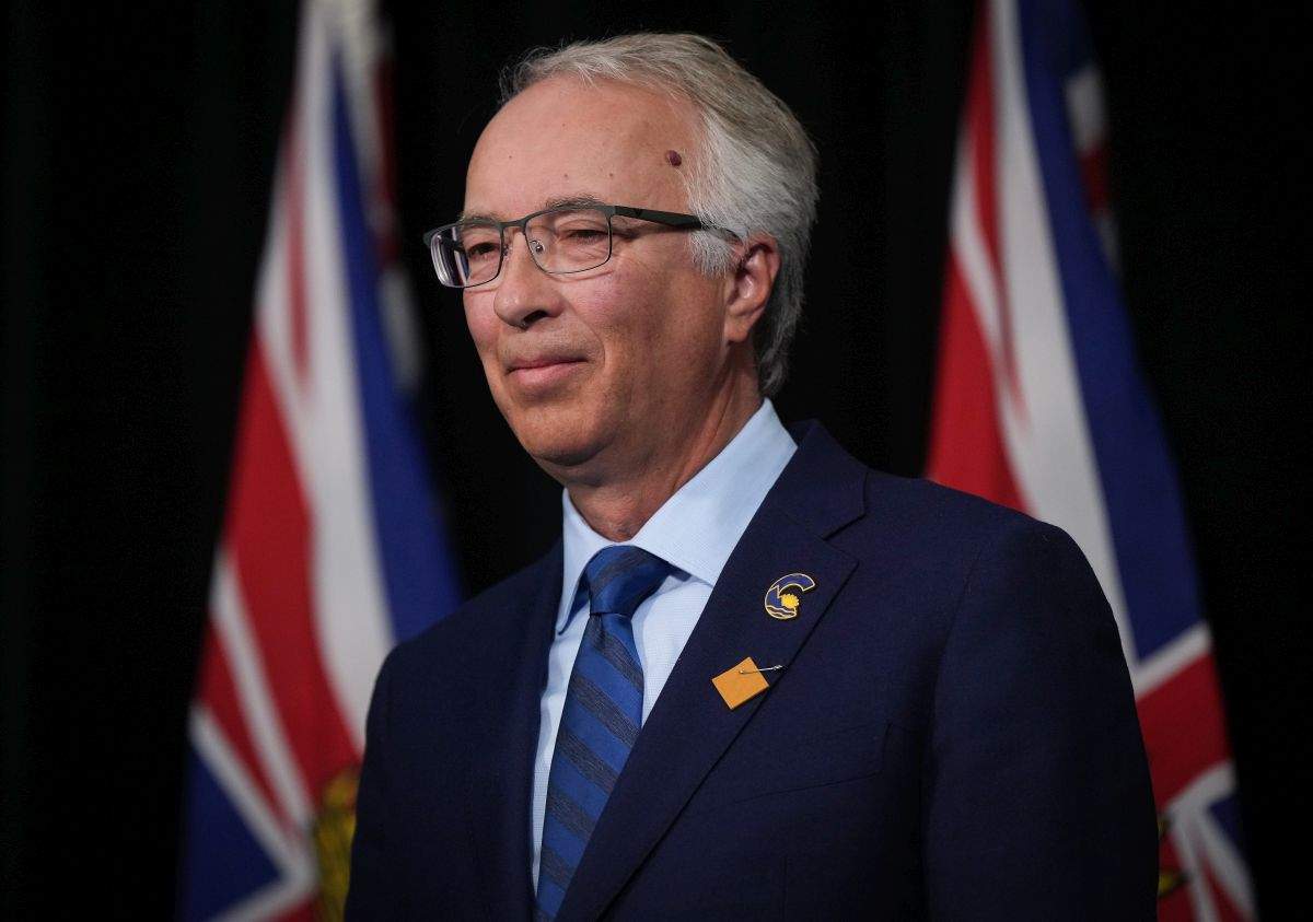 BC Conservative Leader John Rustad listens during a news conference with BC United Leader Kevin Falcon in Vancouver, on Wednesday, August 28, 2024.