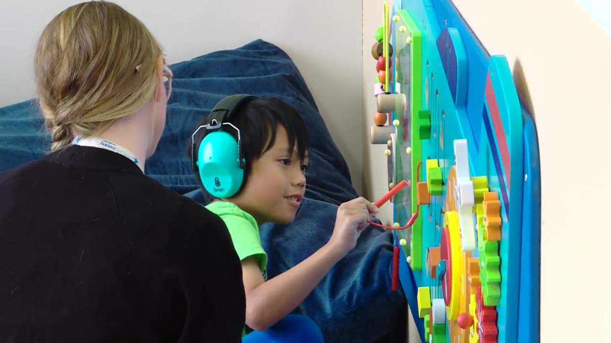 A student and instructor at the Jim Jiwani Autism Academy in Edmonton on Thursday, September 12, 2024.