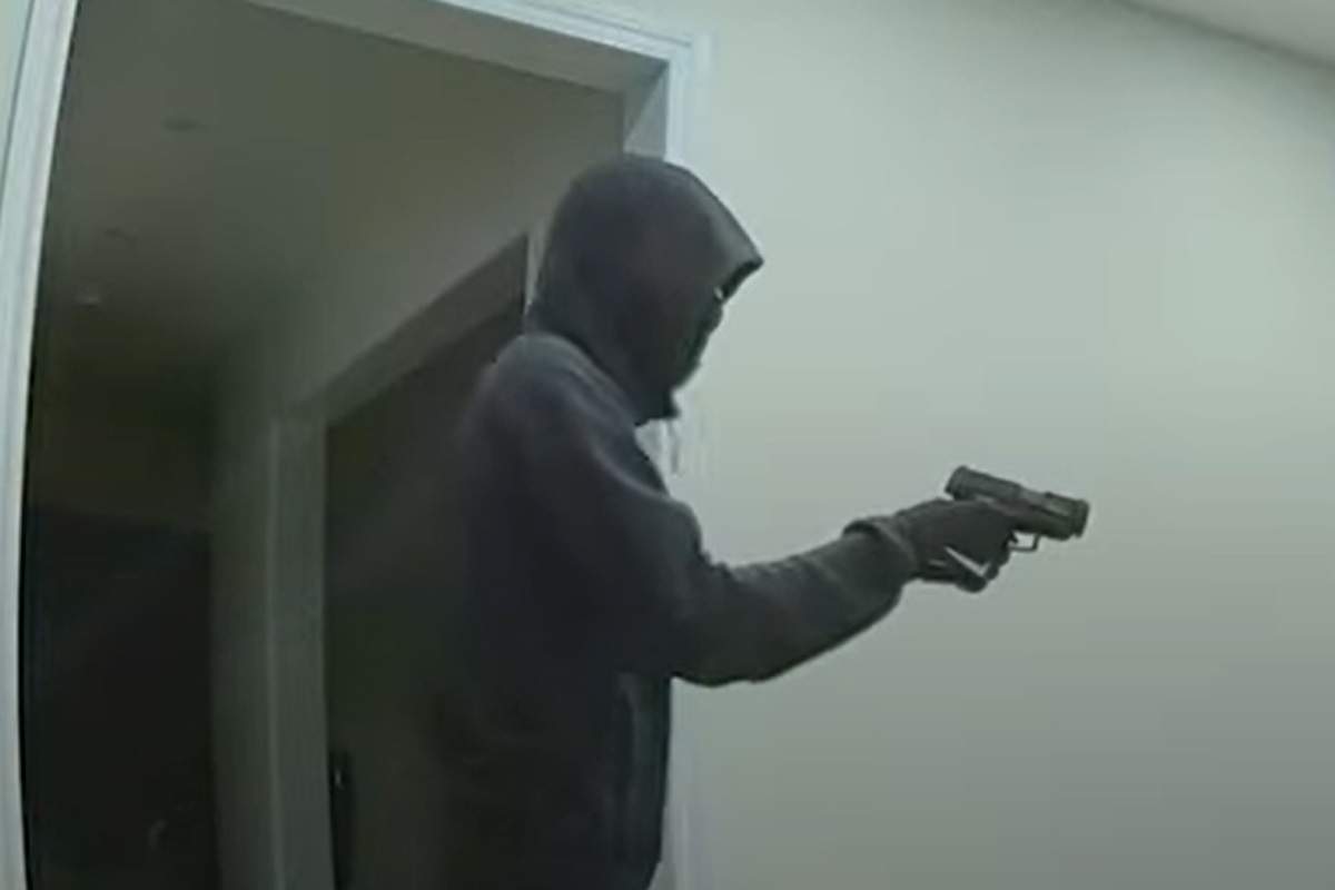 In the video, a man appears to be waving a gun at his victims.