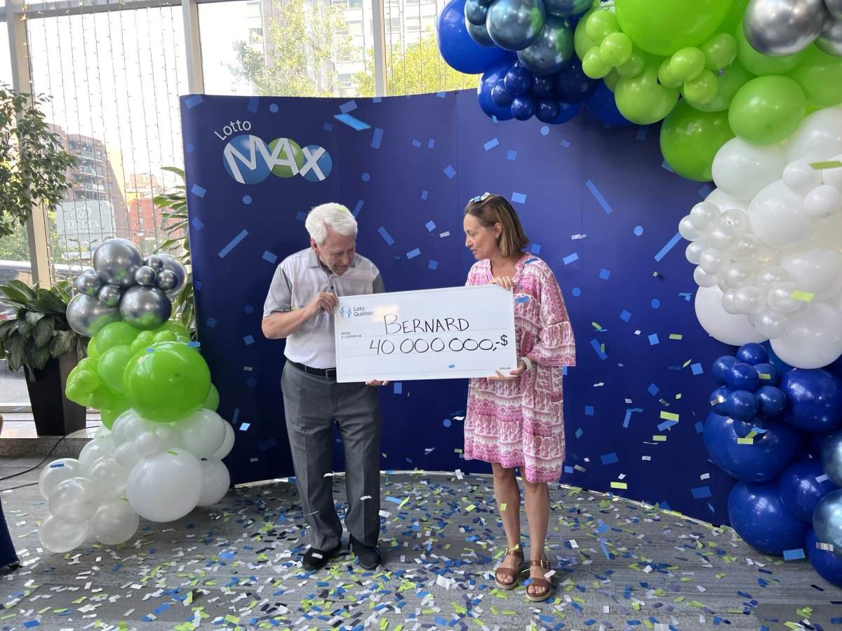 Bernard Morissette is handed a cheque for $40 million on Friday, Sept. 20 2024, after winning part of the Lotto Max jackpot.