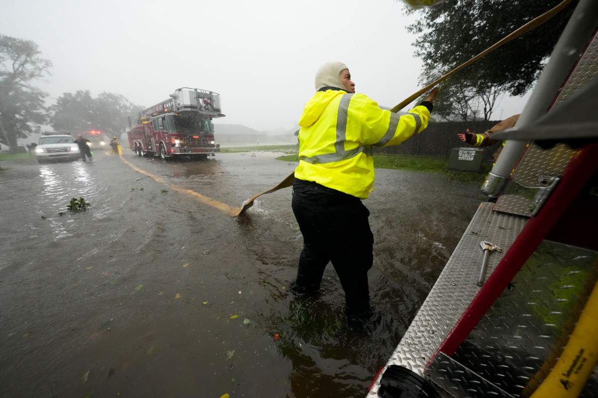 Morgan City firefighters respond to a home fire during Hurricane Francine in Morgan City, La., Wednesday, Sept. 11, 2024.