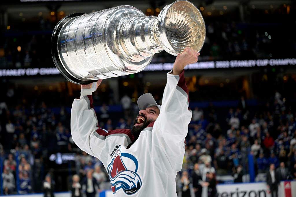 Colorado Avalanche centre Nazem Kadri lifts the Stanley Cup after the team defeated the Tampa Bay Lightning in Game 6 of the NHL hockey Stanley Cup Finals on June 26, 2022, in Tampa, Fla. Pulling out a chunk of his idol Joe Thornton's beard in a fight, riding the roller-coaster of being a Toronto Maple Leaf and becoming the first Muslim player to win a Stanley Cup are chronicled in Kadri's book "Dreamer: My Life On The Edge."