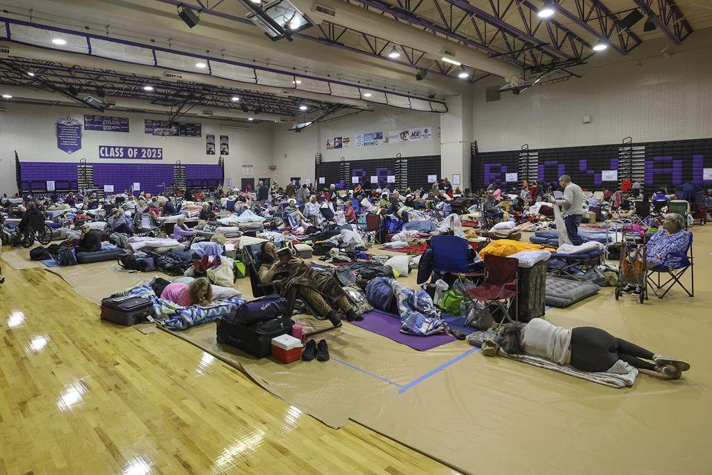 A view of some of the 700 evacuees in the gymnasium in shelter at River Ridge Middle/High School in preparation for Hurricane Milton on Wednesday, Oct. 9, 2024, in New Port Richey, Fla.