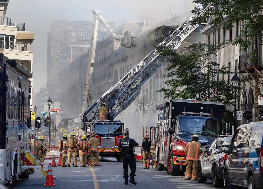 Firefighters battle a fire in Old Montreal on Oct.4.