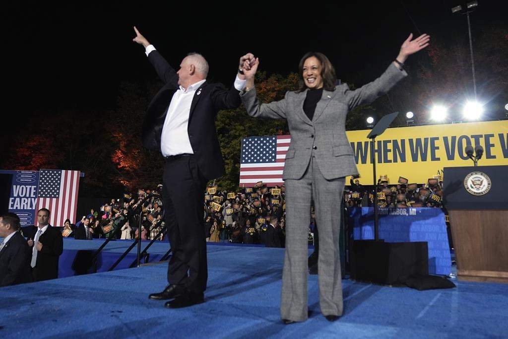 FI;E - Democratic presidential nominee Vice President Kamala Harris, right, and her running mate Minnesota Gov. Tim Walz depart after speaking during a campaign rally at Burns Park in Ann Arbor, Mich., Monday, Oct. 28, 2024.