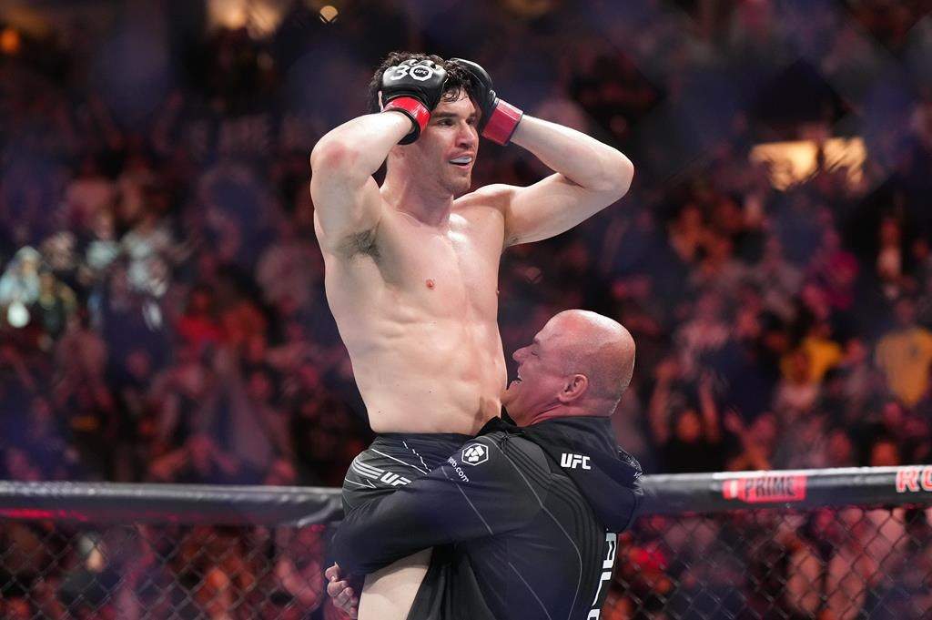 Mike Malott reacts after defeating Adam Fugitt by submission during a UFC 289 welterweight bout, in Vancouver, on Saturday, June 10, 2023. Canadian welterweight (Proper) Mike Malott can't wait to get back in the UFC cage Saturday in Edmonton. THE CANADIAN PRESS/Darryl Dyck.