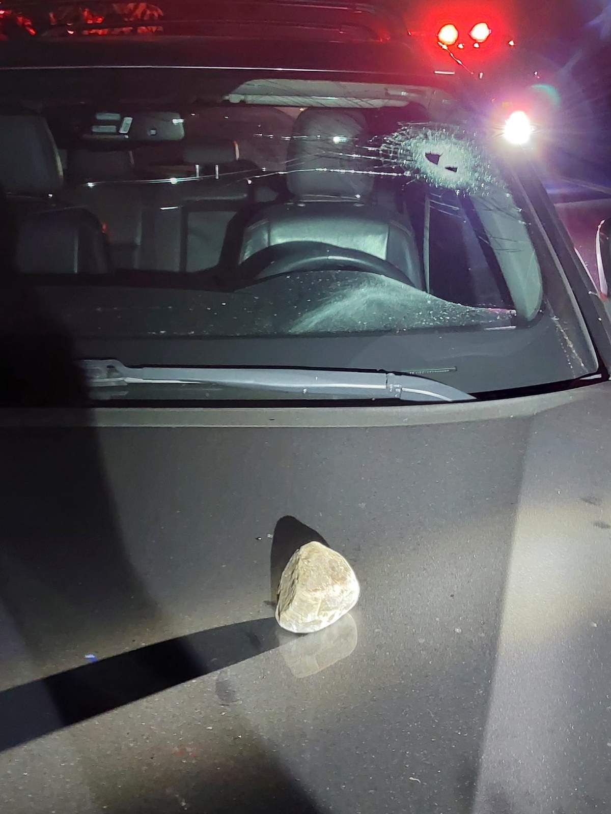 Police release this image of a rock allegedly thrown at a vehicle’s windshield.