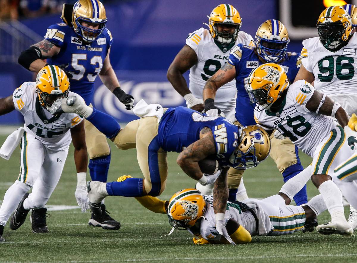 The Elks defence tackles Bombers running back Brady Oliviera during a game on Friday, September 27, 2024.