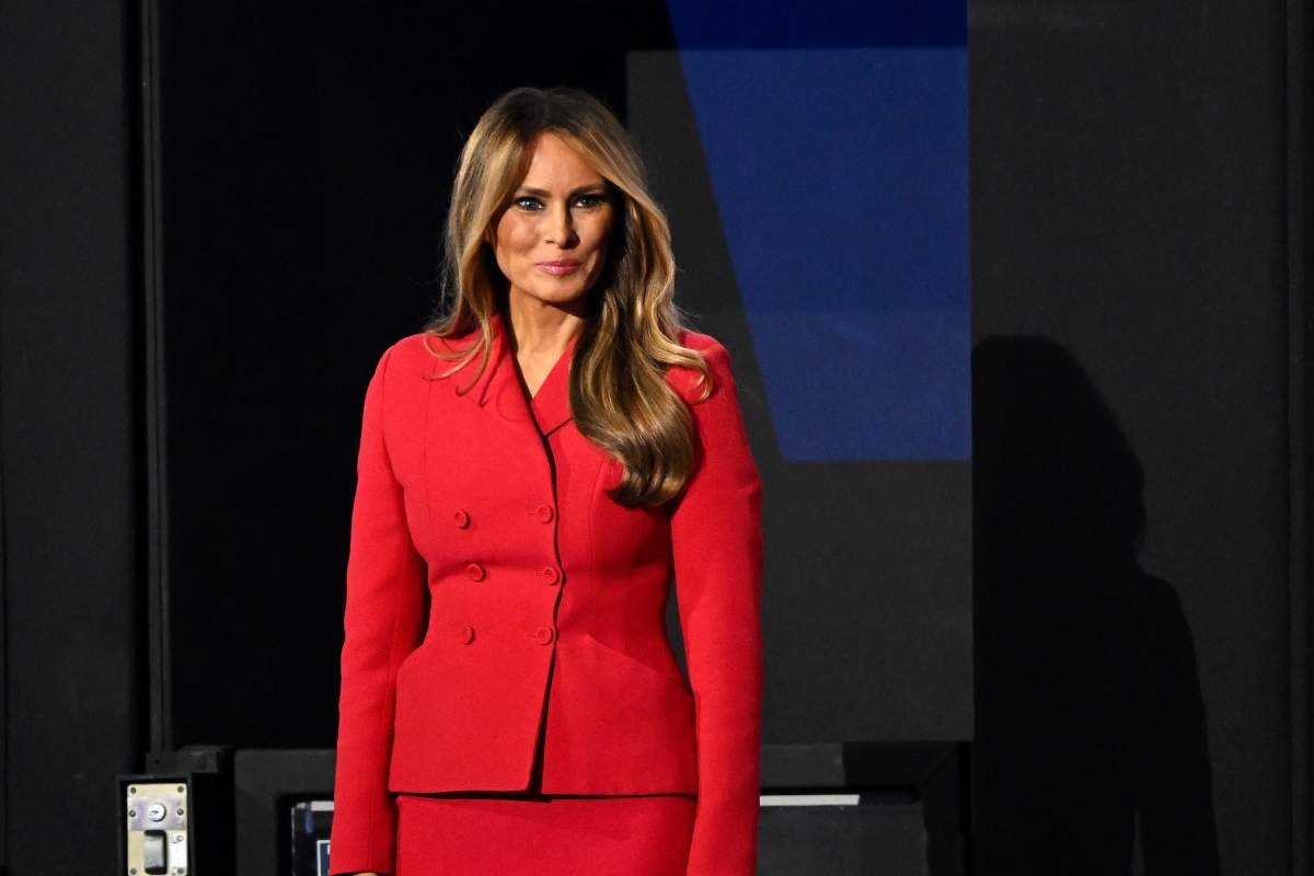 Melania Trump in a red blazer and skirt.
