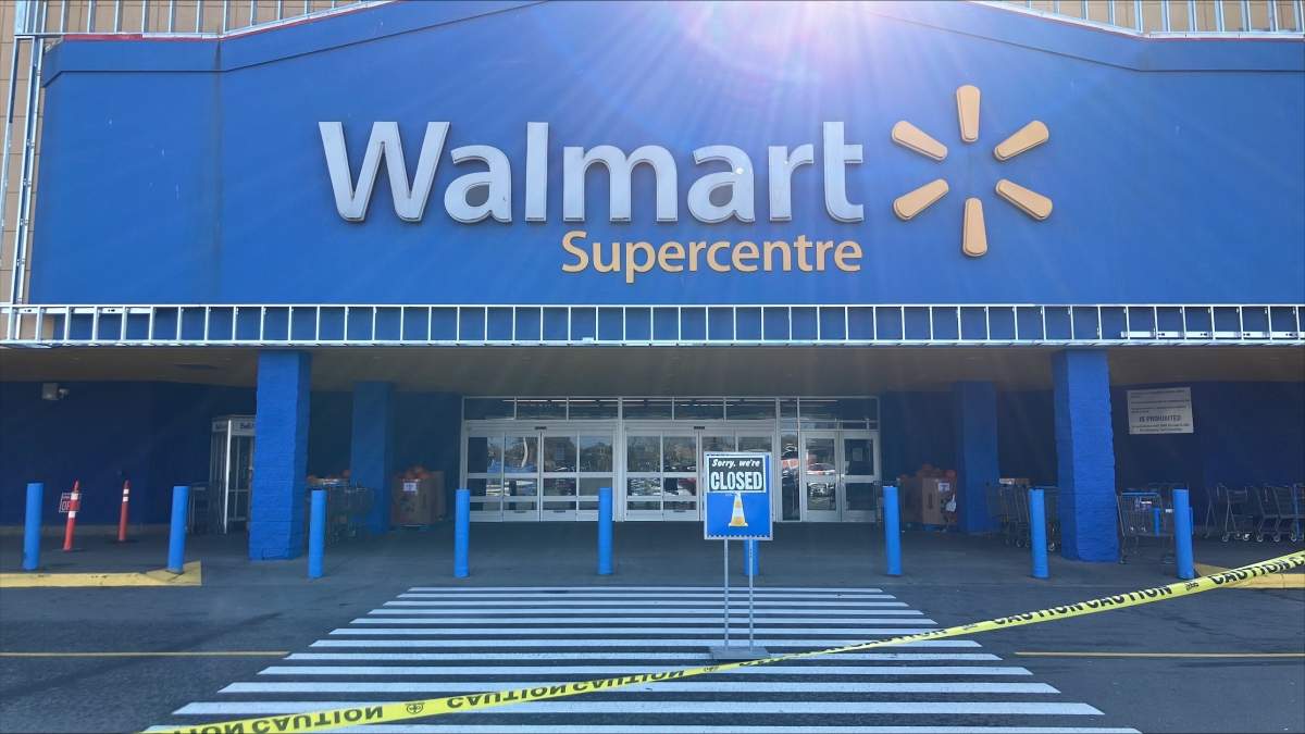 Caution tape, a sign that says ‘sorry, we’re closed’ in front of at a Walmart in Halifax on Oct. 21, 2024.