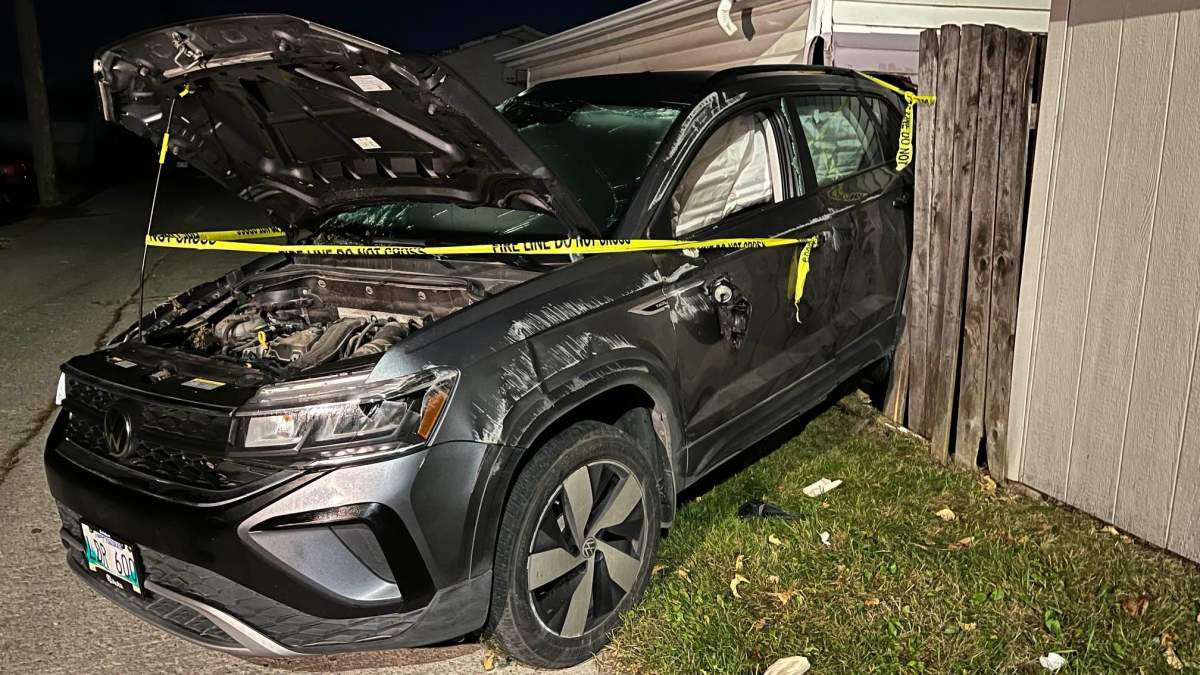 A witness to the crash says the SUV appeared to have flipped over before crashing into a garage.