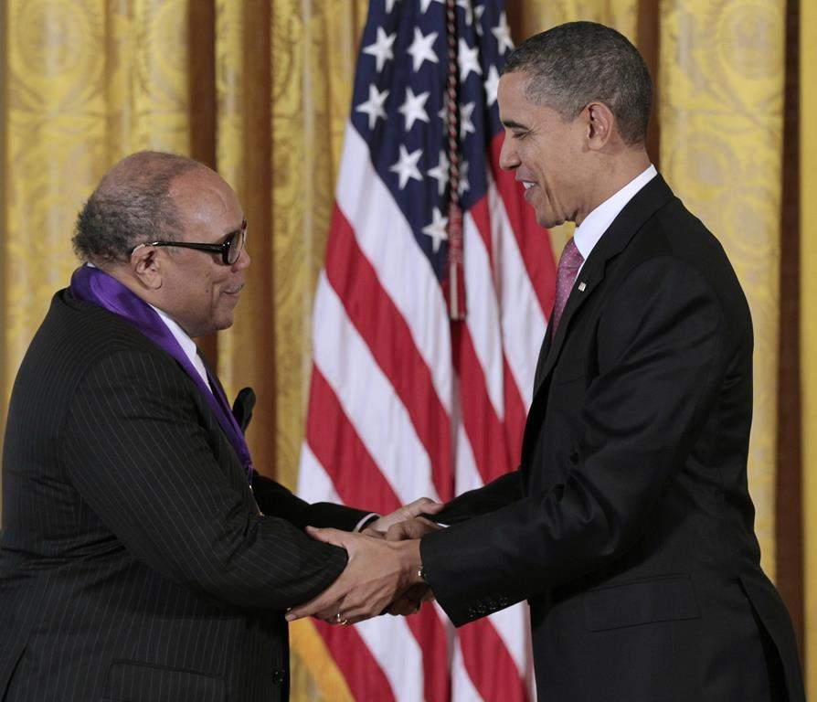 FILE - President Barack Obama presents a 2010 National Medal of Arts to musician and record producer Quincy Jones, Wednesday, March 2, 2011, during a ceremony in the East Room of the White House in Washington.