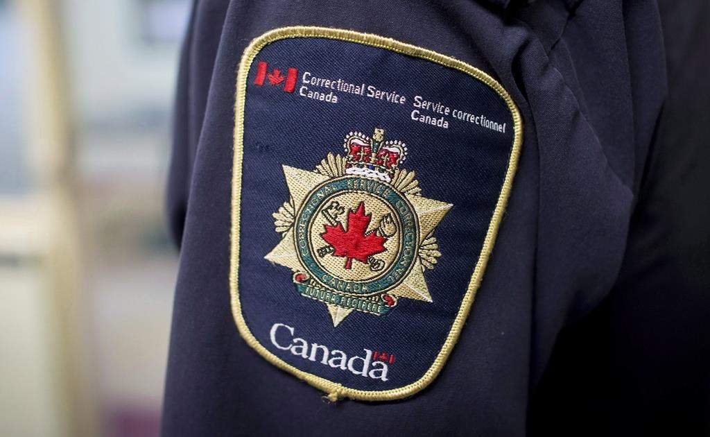 Patches are seen on the arm and shoulder of a corrections officer in the segregation unit at the Fraser Valley Institution for Women during a media tour, in Abbotsford, B.C., Oct. 26, 2017. THE CANADIAN PRESS/Darryl Dyck.