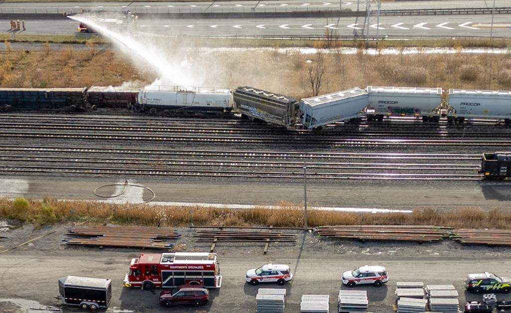 An aerial view as police and firefighters respond to a train derailment in Longueuil, on the south shore of Montreal on Thursday, Nov.14, 2024. THE CANADIAN PRESS/Christinne Muschi