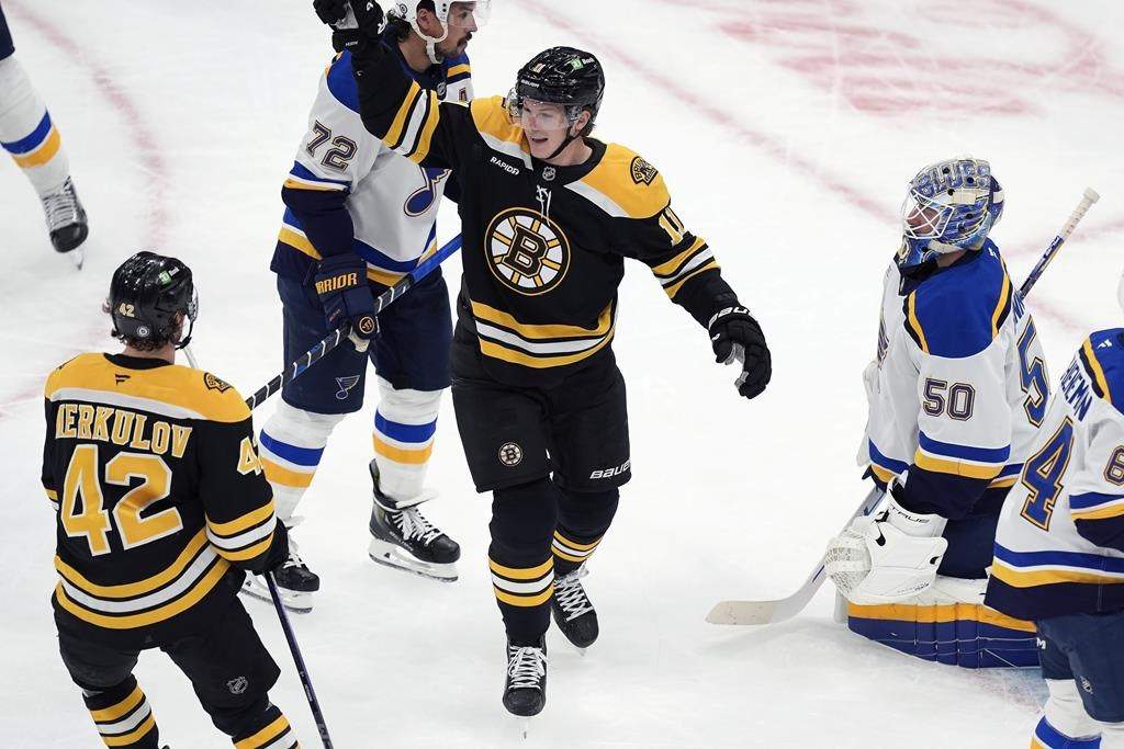 Boston Bruins' Trent Frederic (11) celebrates his second goal of the first period past St. Louis Blues' Jordan Binnington (50) during an NHL hockey game, Saturday, Nov. 16, 2024, in Boston.