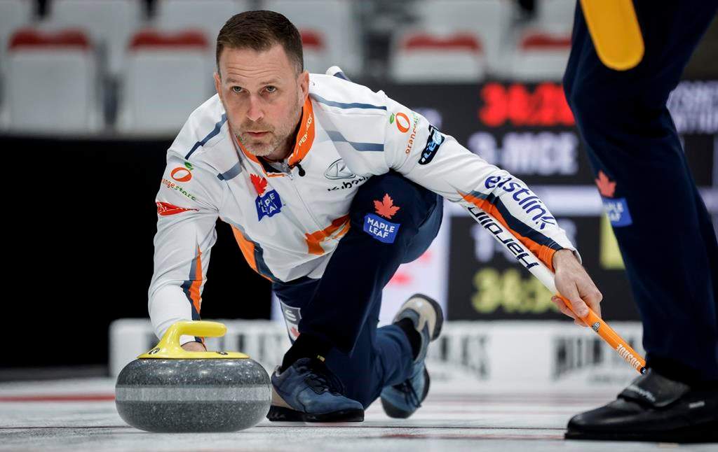 Team Gushue skip Brad Gushue delivers a stone against Team McEwen during the men's curling final at the PointsBet Invitational in Calgary on September 29, 2024.