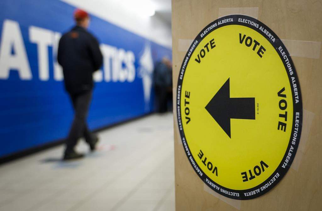 Voters line-up to cast their ballots in a byelection in Medicine Hat, Alta., Tuesday, Nov. 8, 2022. Voters in Lethbridge are facing the first byelection to be held in the province so close to Christmas since Dec. 14, 2017, as Elections Alberta also tries to work around the impact of the Canada Post strike.