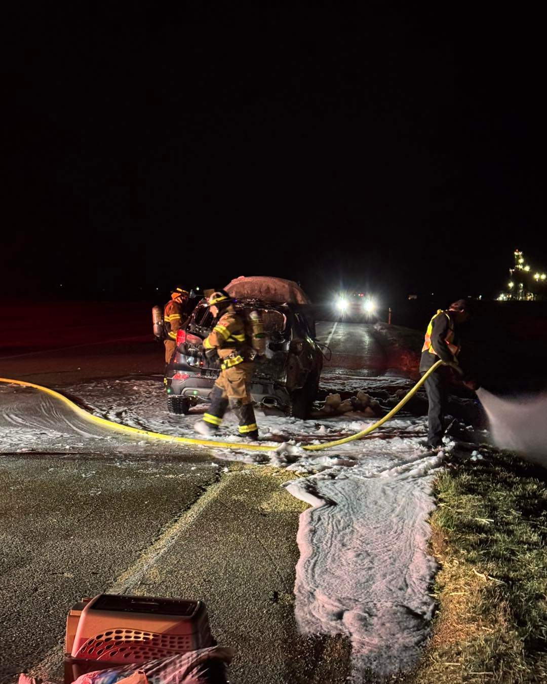 Crews tend to the aftermath of Marc Heethuis-Dubois’s vehicle after he was narrowly able to escape a fire.