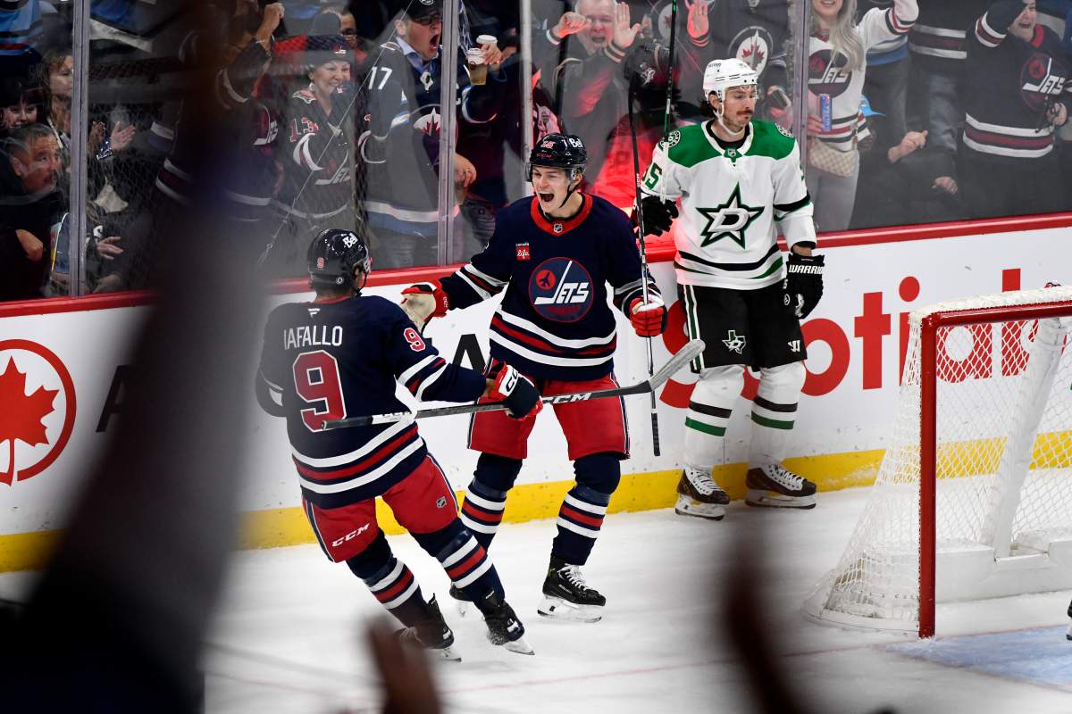 Winnipeg Jets' Rasmus Kupari (15) celebrates his goal on the Dallas Stars with Alex Iafallo (9) during first period NHL hockey action in Winnipeg, Saturday November 9, 2024. THE CANADIAN PRESS/Fred Greenslade.