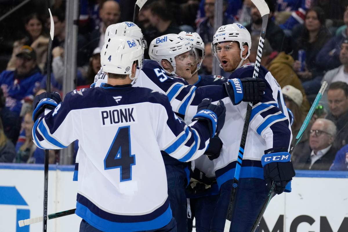 Winnipeg Jets' Gabriel Vilardi, right, celebrates his goal with teammates during the second period of an NHL hockey game against the New York Rangers Tuesday, Nov. 12, 2024, in New York. (AP Photo/Seth Wenig).