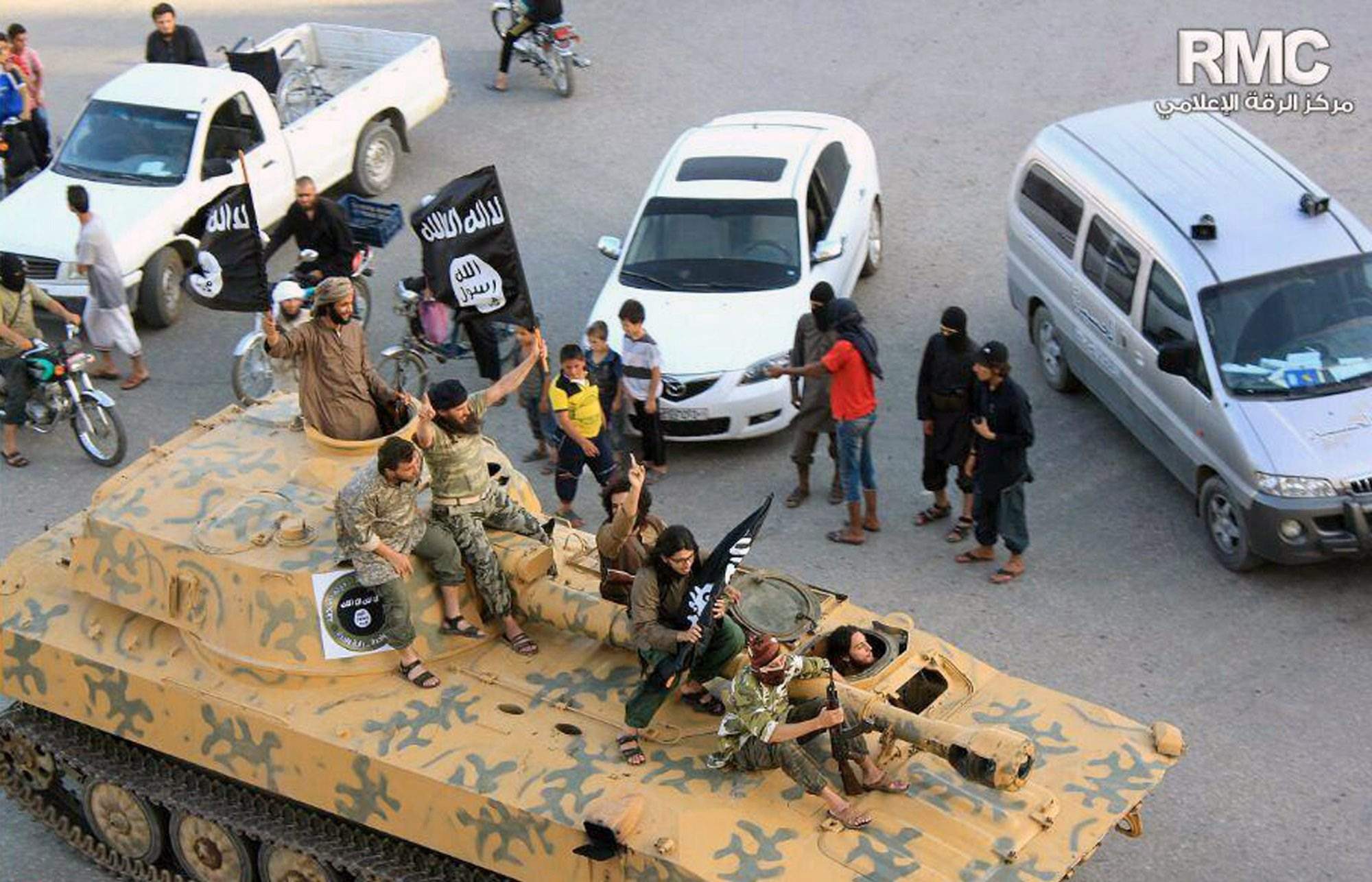 Raqqah Media Center image dated June 30, 2014, shows ISIS in Raqqah, Syria. (AP Photo/Raqqa Media Center)
