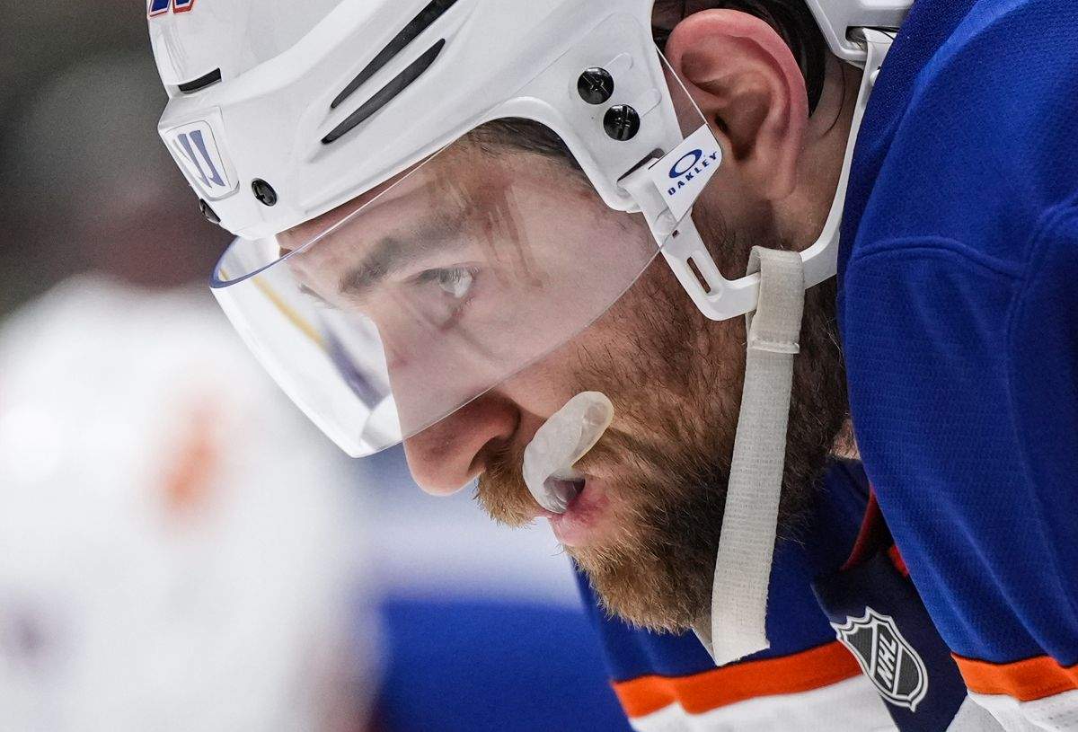 Edmonton Oilers' Leon Draisaitl prepares to take a faceoff during the second period of an NHL hockey game against the Vancouver Canucks, in Vancouver, on Saturday, November 9, 2024.