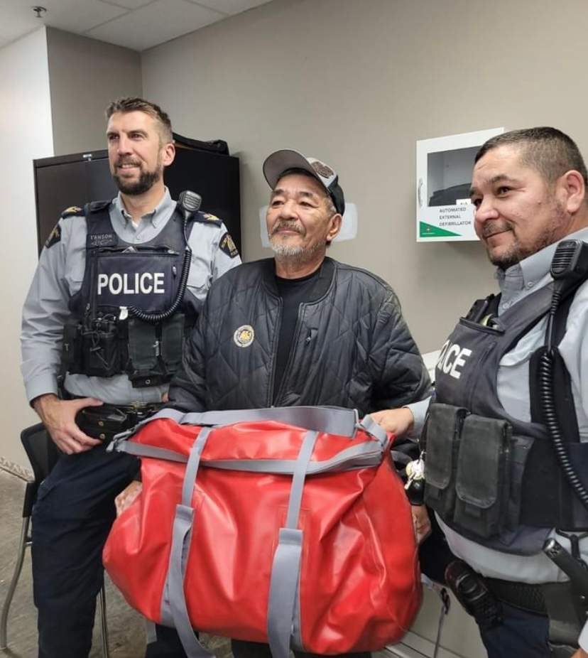 Wilson Moore is honoured for his life's dedication to search and recovery volunteer work in northern Manitoba. Sgt. Andrew I'Anson (left) and S/Cst. Ryan Wrightson presented him with $1000 worth of new search equipment earlier this week.