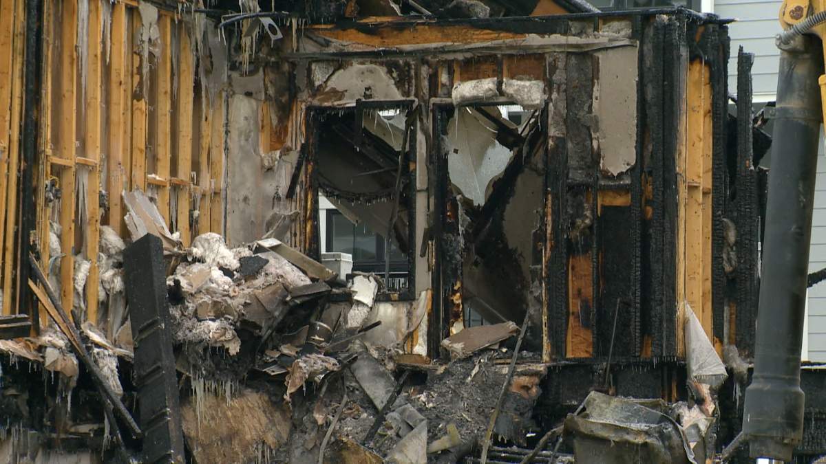 ATCO says it had crews in the area investigating reports a natural gas line had been hit at the time a Calgary townhouse exploded and caught fire.