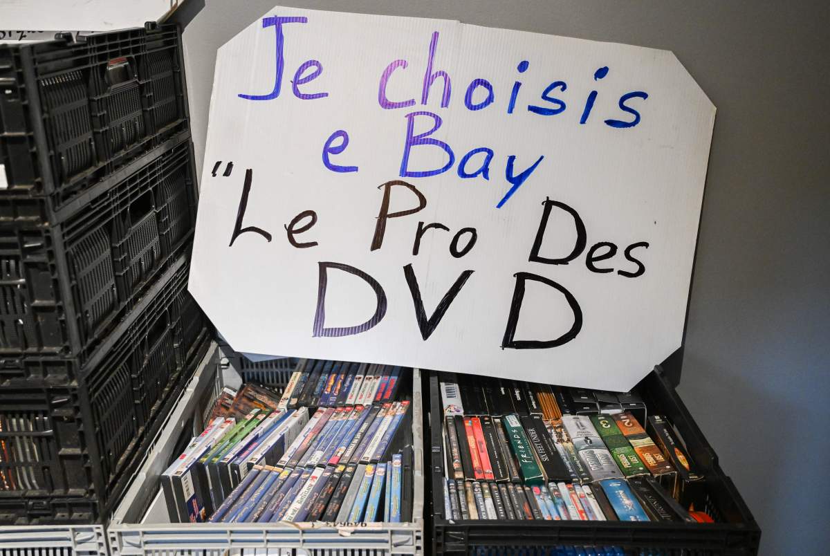 Crates of DVDs are shown in the home of Jean-François Hall in Montreal, Thursday, December 12, 2024. Hall buys and sells DVDs on eBay and facebook.