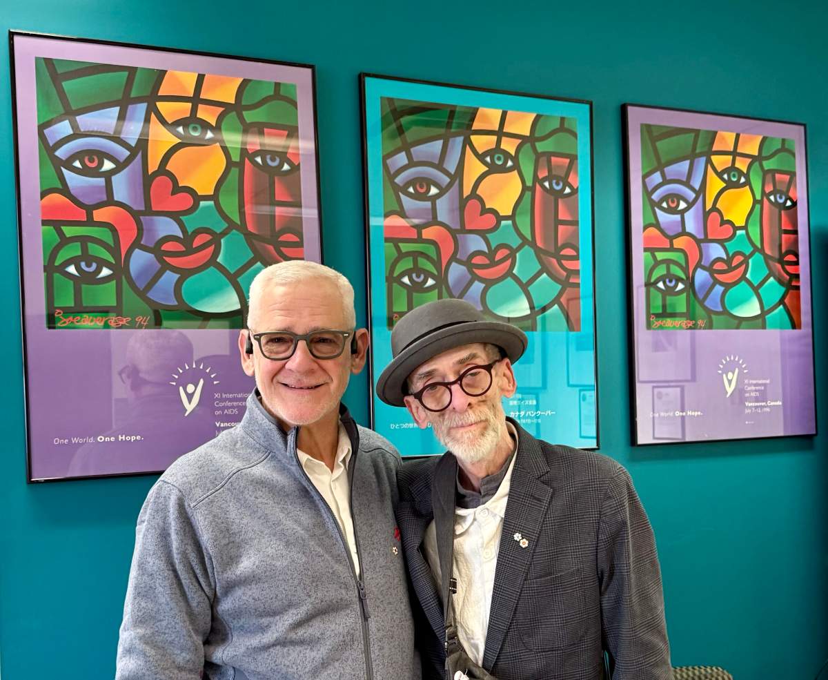 Joe Average and Dr. Julio Montaner posing for a photo in December 2024.