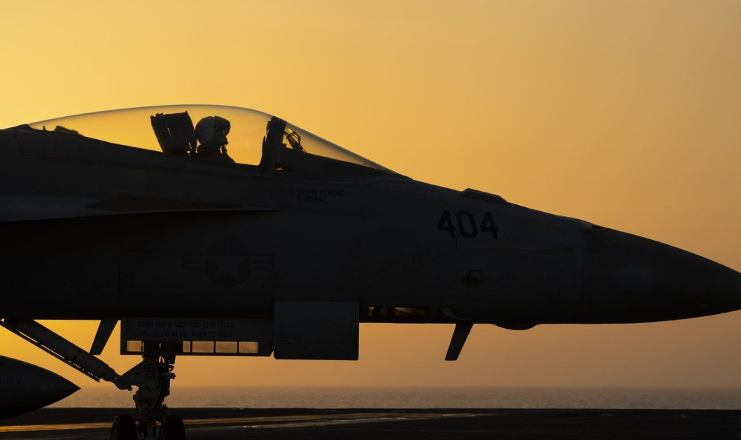 A fighter jet maneuvers on the deck of the USS Dwight D. Eisenhower in the Red Sea.