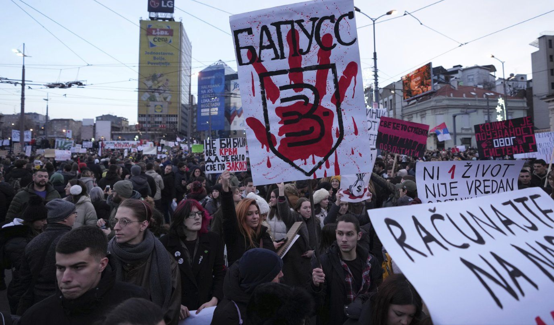 People attend a protest against the Serbian authorities in Belgrade, Serbia, Sunday, Dec. 22, 2024.
