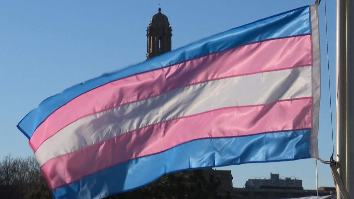 The Transgender flag flies in front of the Alberta legislature.