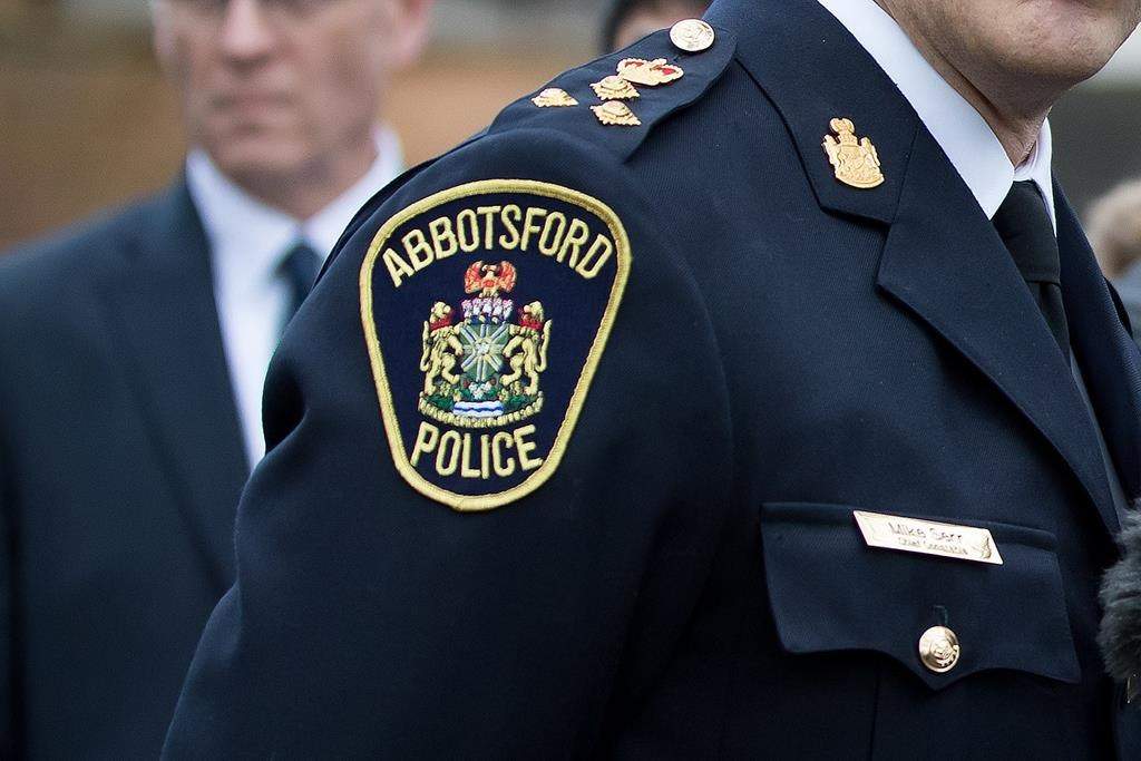 An Abbotsford police shoulder patch is seen during a press conference in New Westminster, B.C., Feb. 3, 2020. 