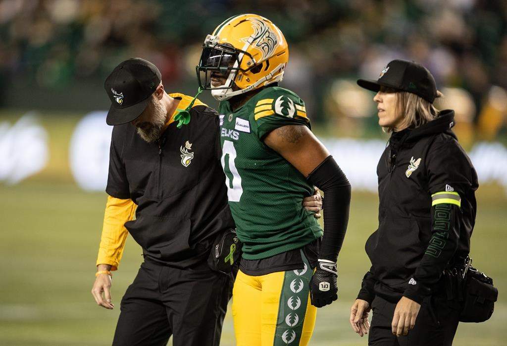 Edmonton Elks' Loucheiz Purifoy (0) is injured against the Winnipeg Blue Bombers during second half CFL action in Edmonton, Alta., on Thursday August 10, 2023.