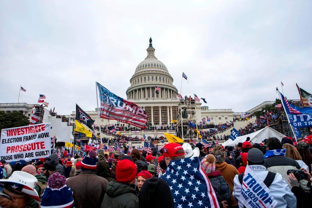 A third of those charged over the pro-Trump insurrection at the U.S. Capitol on Jan. 6, 2021, were women, an intelligence report says. THE CANADIAN PRESS/AP, Jose Luis Magana