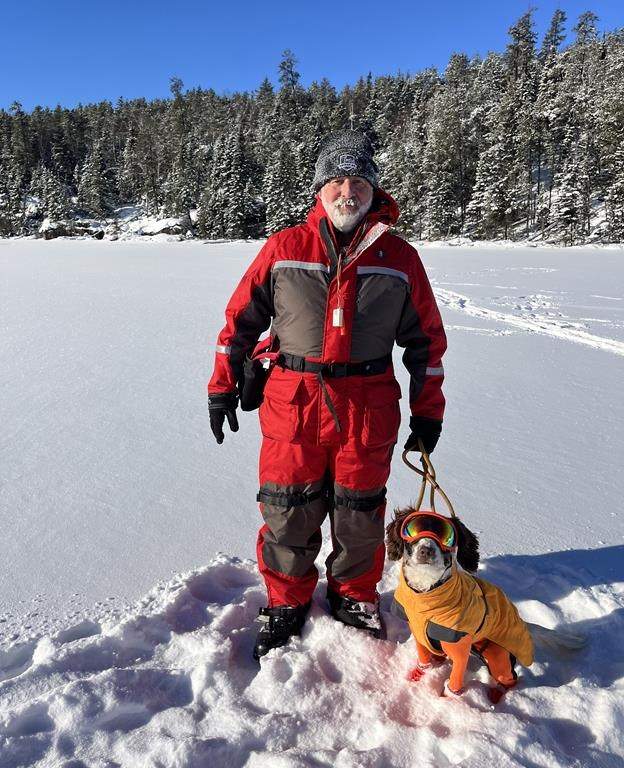 Oil spill-sniffing dog Poppy, a springer spaniel, and her trainer Paul Bunker are shown in a handout photo.